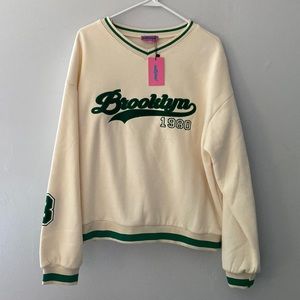 Never worn. Pullover hoodie type. Varsity style.